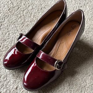 Burgundy pumps with decorative buckles